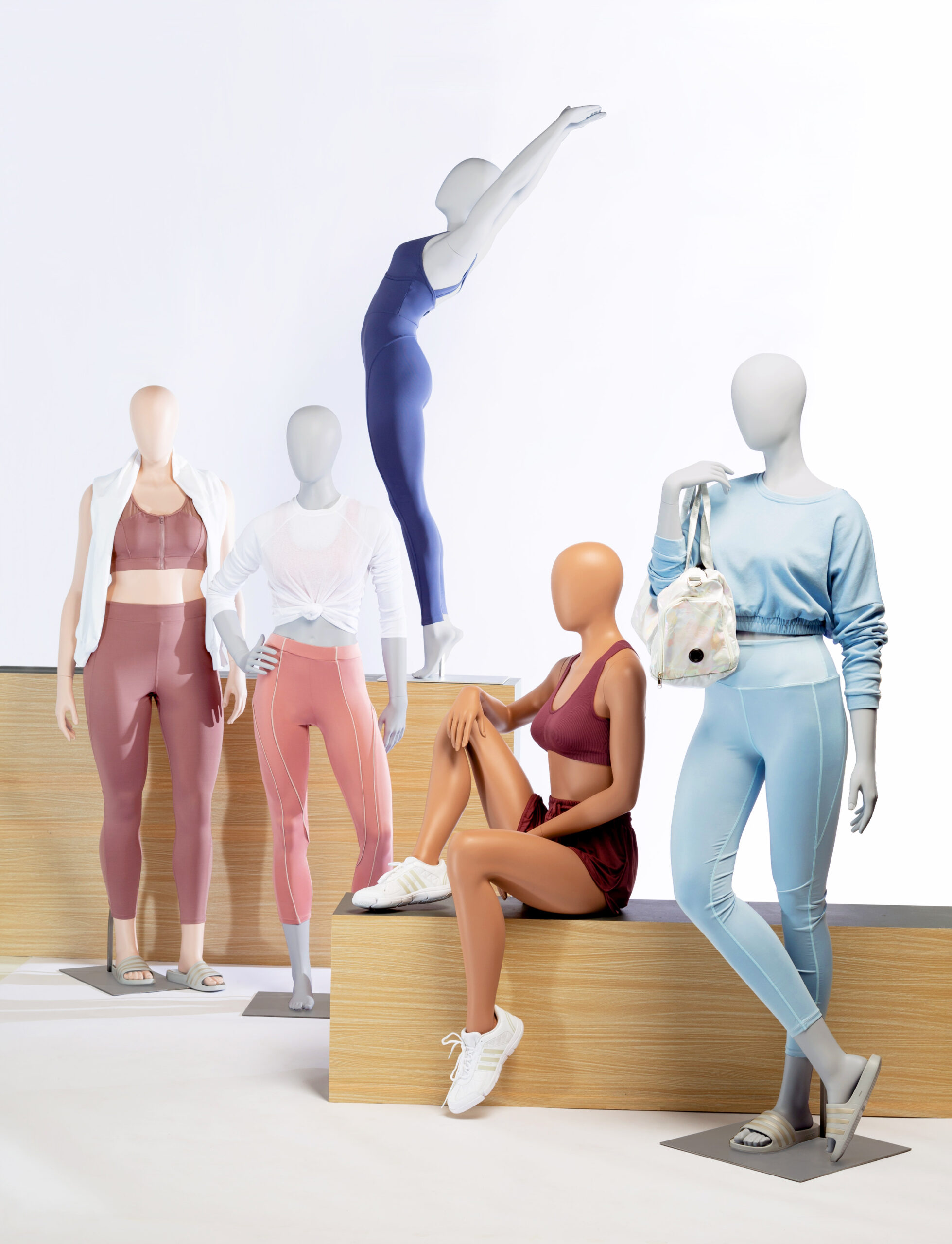 Five mannequins posing. Fusion Sweat collection.